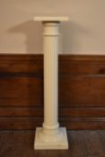 A vintage painted torchère with fluted column on stepped base. H.109 W.26cm