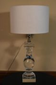 A contemporary Perspex baluster form table lamp. H.78 W.40cm