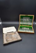 A late 19th century engraved silver plated canteen of twelve fish knives and forks with mother of