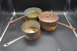 Three large vintage copper pans, one with lid. H.16 Dia.22.5cm (largest)