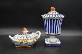 A Continental lidded urn and pierced lidded dish, both with fruit finials and hand gilded and