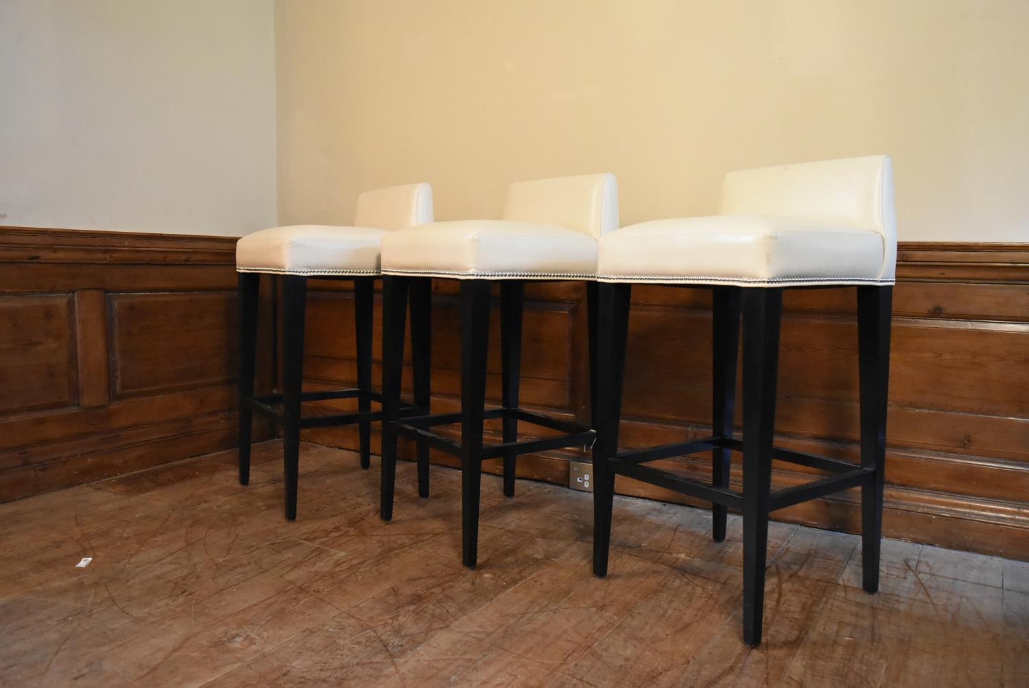 A set of three contemporary bar stools in studded ivory upholstery on square tapering stretchered - Image 3 of 5