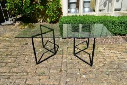 An Italian dining table with plate glass top on metal trestle style supports. L.200 H.70 W.90cm