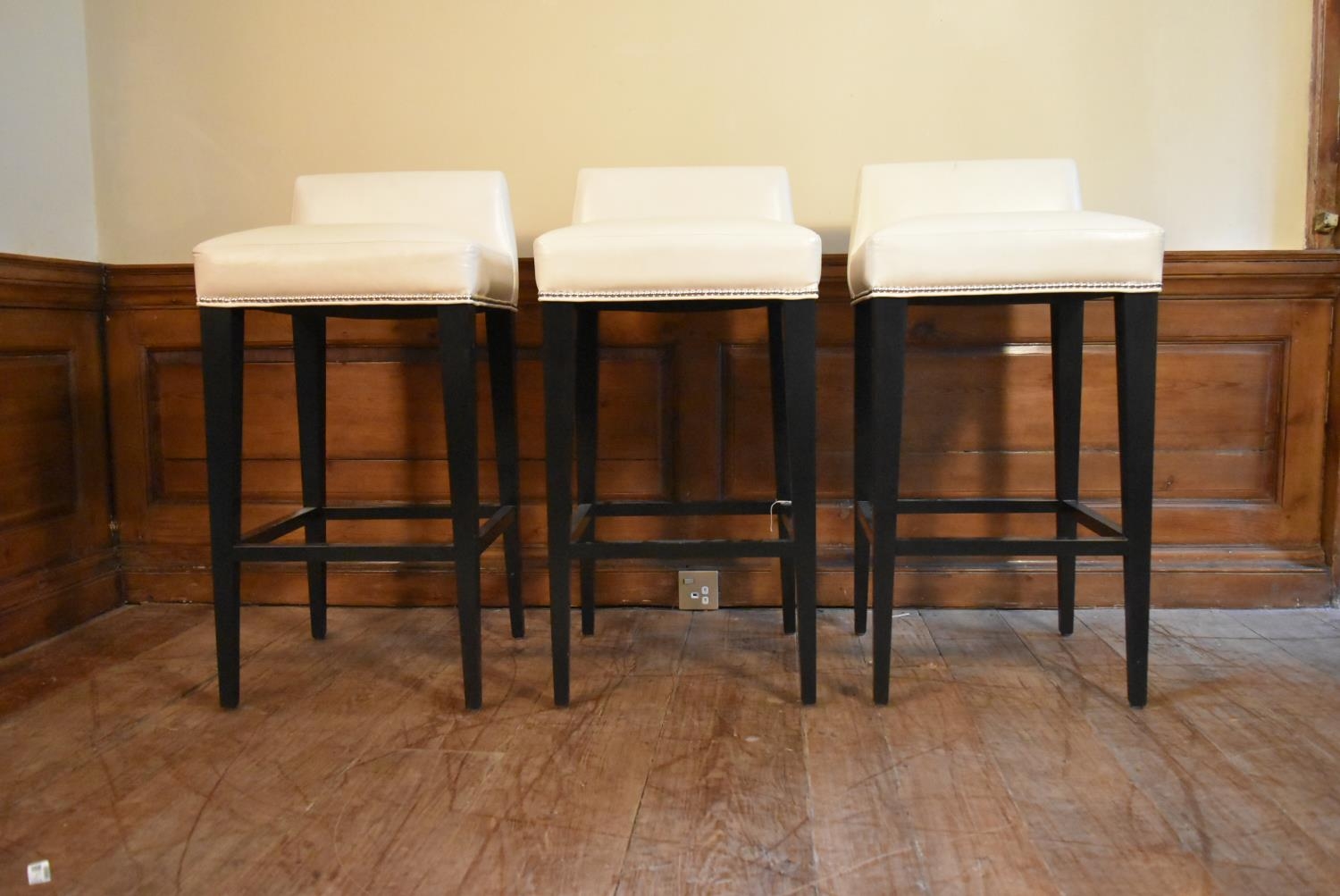 A set of three contemporary bar stools in studded ivory upholstery on square tapering stretchered - Image 2 of 5