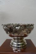 A silver plated wine cooler with fitted interior and grape and vine decoration to the rim. H.30 W.