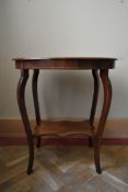 A late Victorian rosewood centre table with central floral spray inlay on shaped cabriole supports