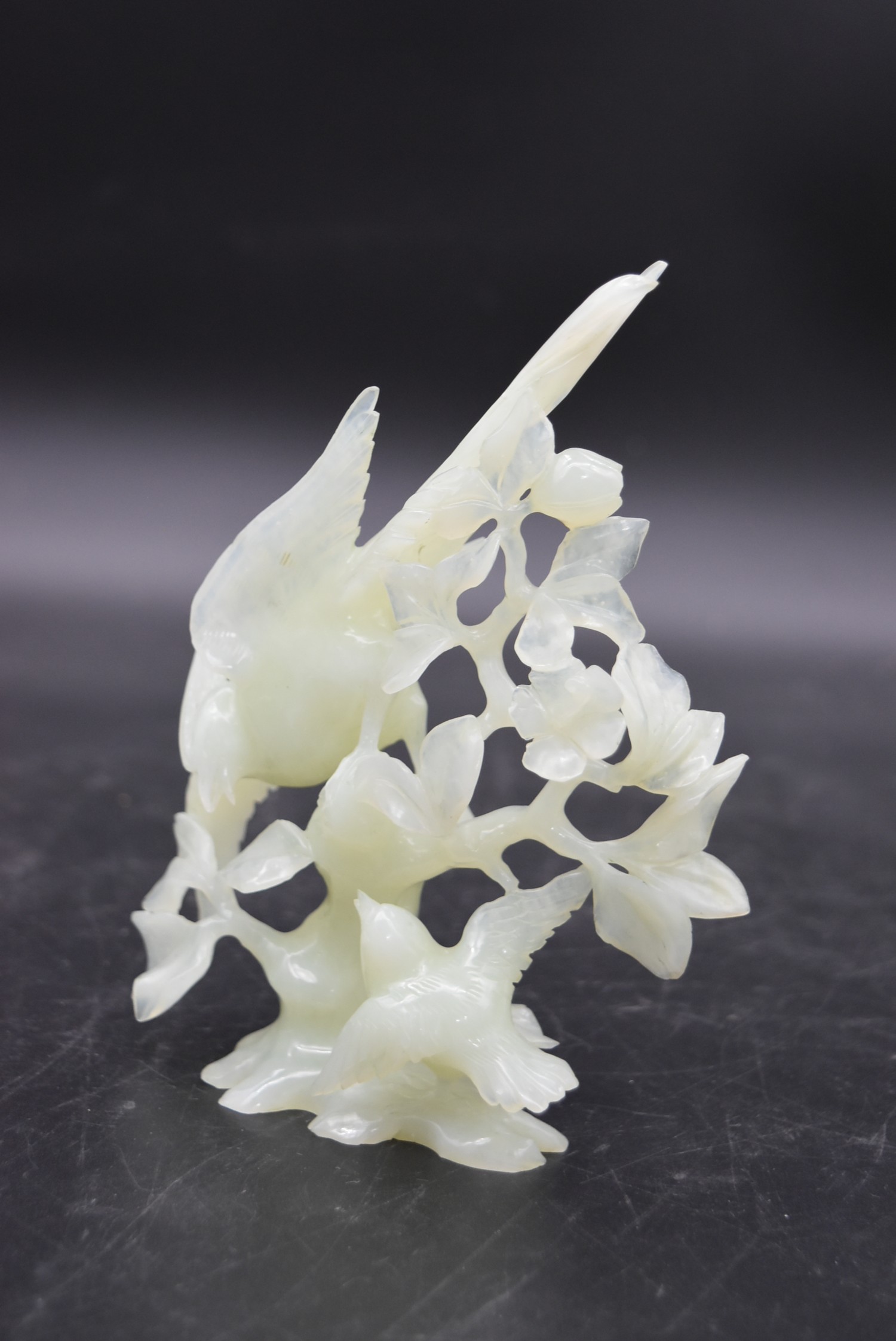 Two Chinese carved and pierced jade figure groups of song birds among blossom and foliage. One - Image 2 of 6