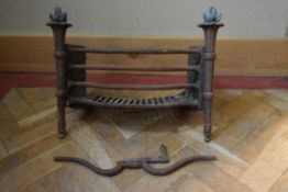 A 19th century fire grate with flaming torch finials. H.43 W.49cm