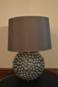 A contemporary table lamp of chrome and glass cabochons with shade. H.60 W.38cm