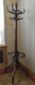 A 19th century bentwood coat and umbrella hallstand. H.200cm (two coat hooks are missing as