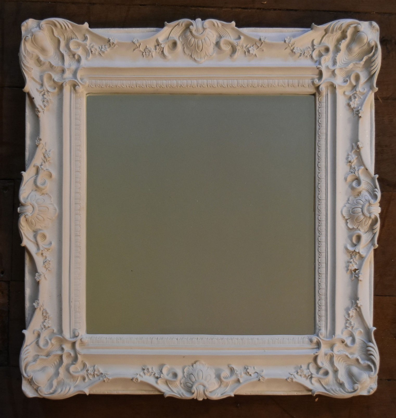 A white painted Rococo style wall mirror and a similar gilt example. H.90 W.64cm (largest) - Image 5 of 7
