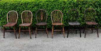 A collection of 6 country Windsor chairs with classical hoop back and spindles and one with