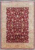 A fine silk and wool Tabriz carpet with all over scrolling meandering lotus flower and palmette