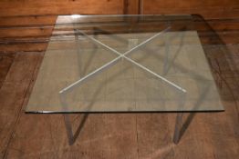 A Knoll Studio Barcelona coffee table designed by Mies van der Rohe with plate glass top on chrome