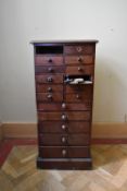 A 19th century mahogany specimen cabinet with an arrangement of drawers on plinth base. H.98 W.46