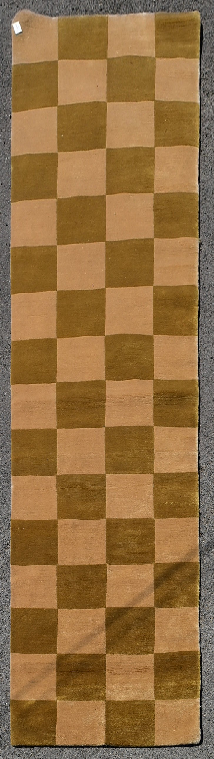 A contemporary runner with pale gold and salmon pink chequerboard pattern. L.375 W.91cm