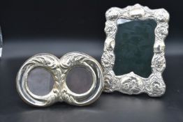 An embossed silver framed easel picture frame, Birmingham 1897 and a late 19th century silver twin
