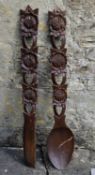A large decorative carved novelty spoon and fork. H.97cm