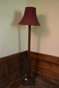 An Art Deco oak standard lamp with it's original shade. H.185cm
