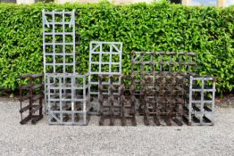A collection of eight wine racks, various sizes. H.100 W.34 D.24cm (8)