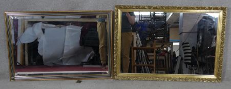 Two bevelled glass wall mirrors in gilt frames, one with damage as photographed. H.68.5 W.98.5cm