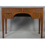 A 19th century mahogany writing table with original plate brass handles on square tapering