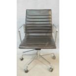 A vintage Charles and Ray Eames inspired Aluminium Group style office desk armchair in black