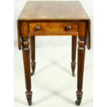 A small late Georgian mahogany drop flap Pembroke table with end drawer on tapering reeded