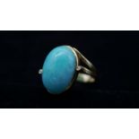 An 18 carat yellow gold amazonite and diamond cocktail ring. Set to centre with an oval cabochon