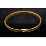 An Italian expanding woven 9 carat gold bracelet. Hallmarked: Sheffield, 375, Italy. D.6.5cm