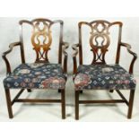 A pair of Georgian mahogany Chippendale style open armchairs with pierced back splat on chamfered