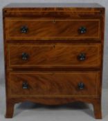 A small Regency mahogany chest of drawers with satinwood inlay on swept bracket feet. H.90 W.76.5