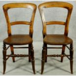 A pair of Victorian beech framed bedroom chairs. H.83cm