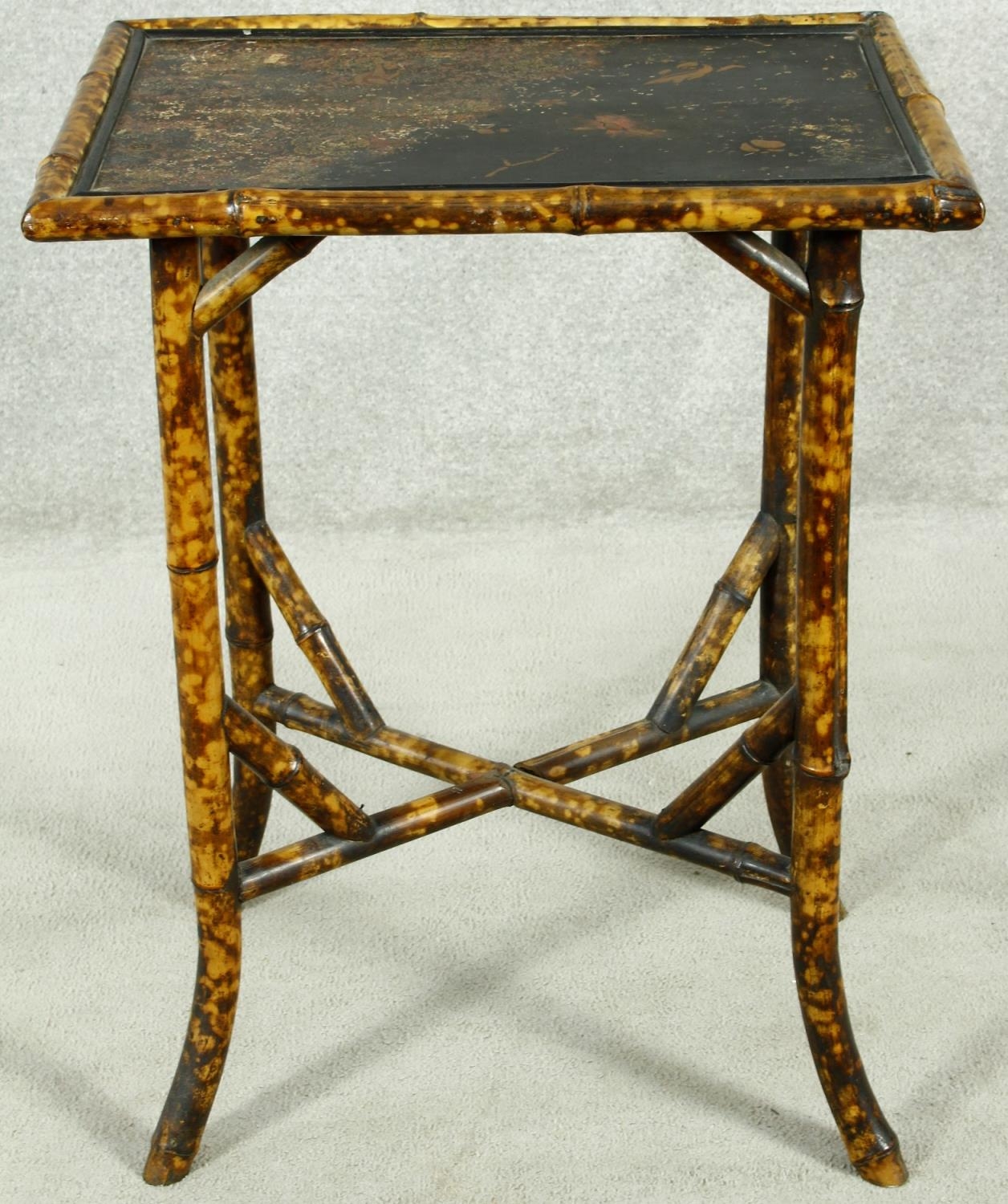 A late 19th century bamboo occasional table with Japanned lacquered top. H.72 W.56 D.41cm