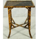 A late 19th century bamboo occasional table with Japanned lacquered top. H.72 W.56 D.41cm