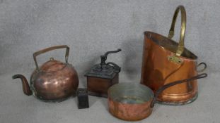 A brass and copper coal scuttle, a copper pan and teapot, a vintage coffee grinder and a 2lb weight.