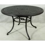 A metal framed garden table with latticework top. H.75 D.120cm