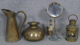 A vintage brass shaving mirror on stand, a brass cased lantern and a brass jug and vase. H.39cm (