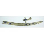 An Indian white metal foliate repousse and floral engraved sword scabbard and hilt set with Lapis