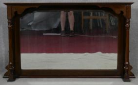 A late 19th century mahogany over mantel mirror with bevelled plate flanked by pilasters, formerly a