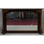 A late 19th century mahogany over mantel mirror with bevelled plate flanked by pilasters, formerly a