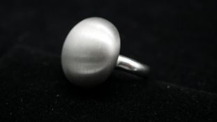 An Italian contemporary sterling silver brushed effect bubble cocktail ring on a D-shape shank.