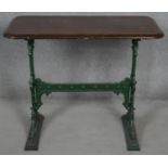 A 19th century cast iron pub table with mahogany top the base marked; Gaskell and Chambers,