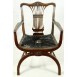 A mahogany Chippendale style X framed armchair with pierced and carved vase shaped back splat. H.