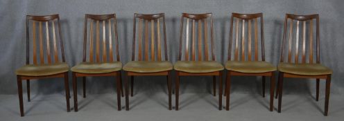 A set of mid century vintage teak G-Plan dining chairs with maker's label to the underside. H.91cm