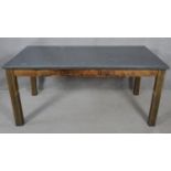 A dining table from reclaimed timbers with metal faced top on square supports. H.76 L.170 W.93cm