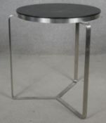 A contemporary designer brushed steel occasional table. H.47 D.39cm