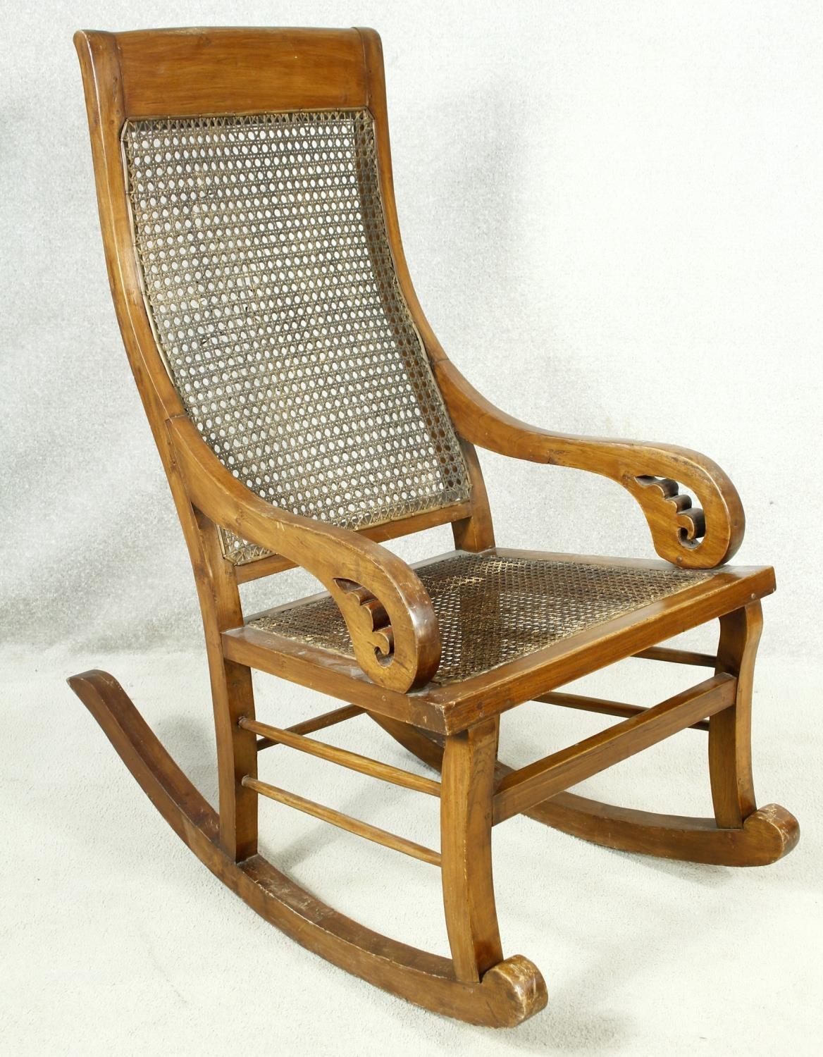 A 19th century Colonial style teak rocking chair with caned back and seat. H.111cm - Image 2 of 5