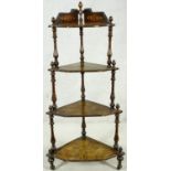 A Victorian burr walnut and ebony with satinwood inlaid corner four tier whatnot on turned supports.
