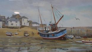 A framed and glazed watercolour, fishing village with boats, signed John Hewitt. H.36 W.52.5cm